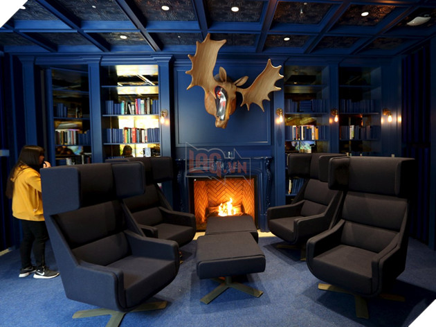 This cool, modern blue library in Ontario is full of books and its own fireplace...