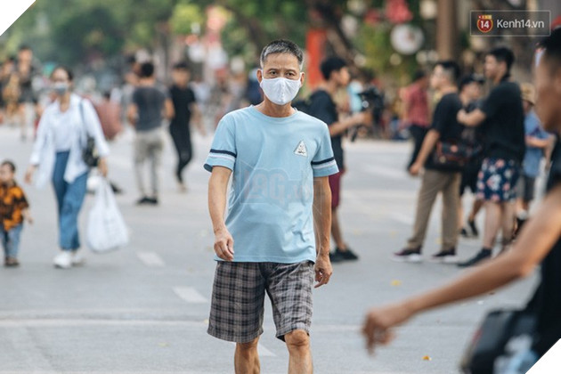 Người dân Sài Gòn và Hà Nội kích hoạt lại các biện pháp phòng chống dịch: Tuân thủ đeo khẩu trang nơi đông người 5